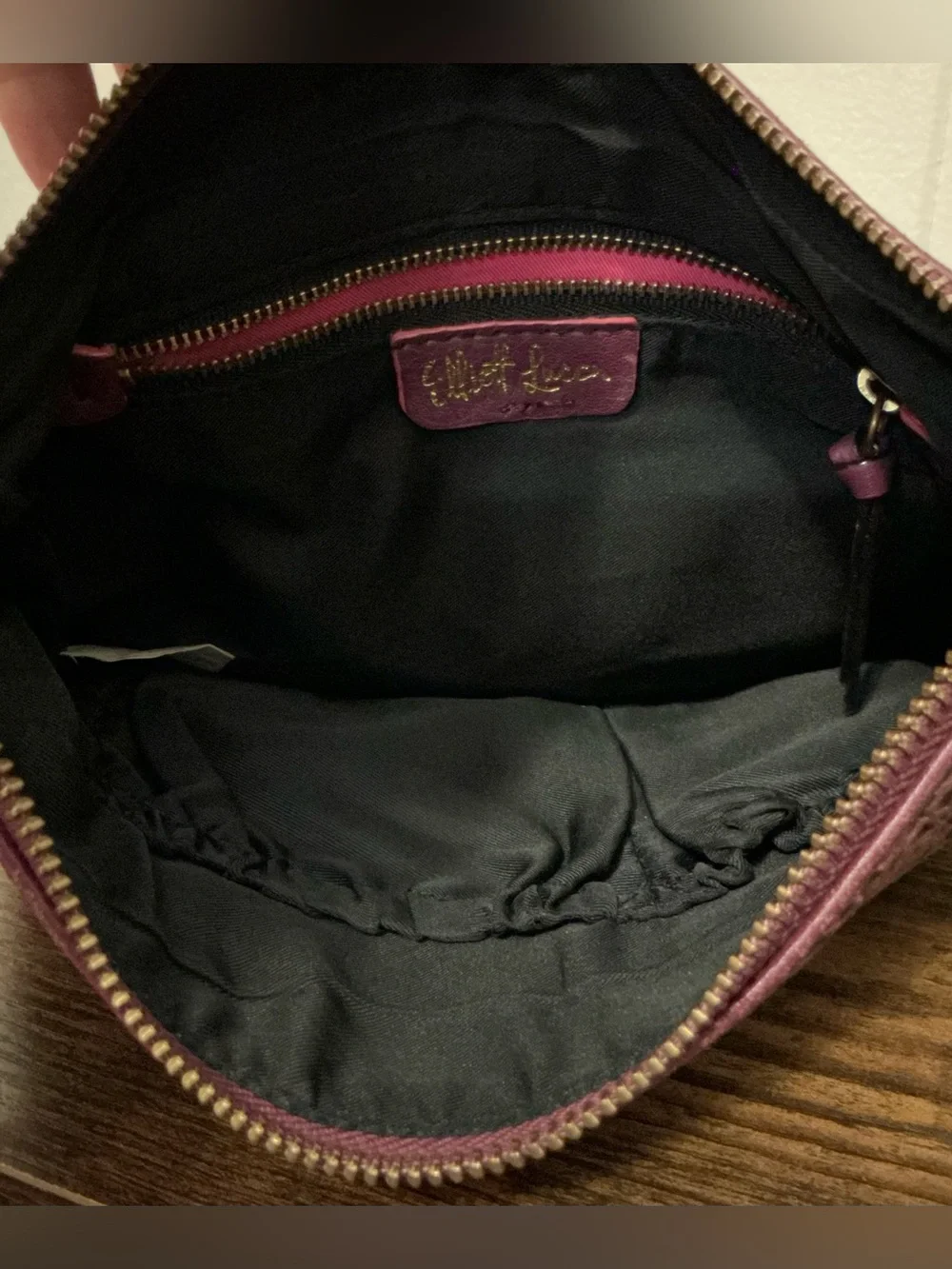 a Vintage Rare Elliott Lucca burgundy Leather laser-cut leather crossbody bag